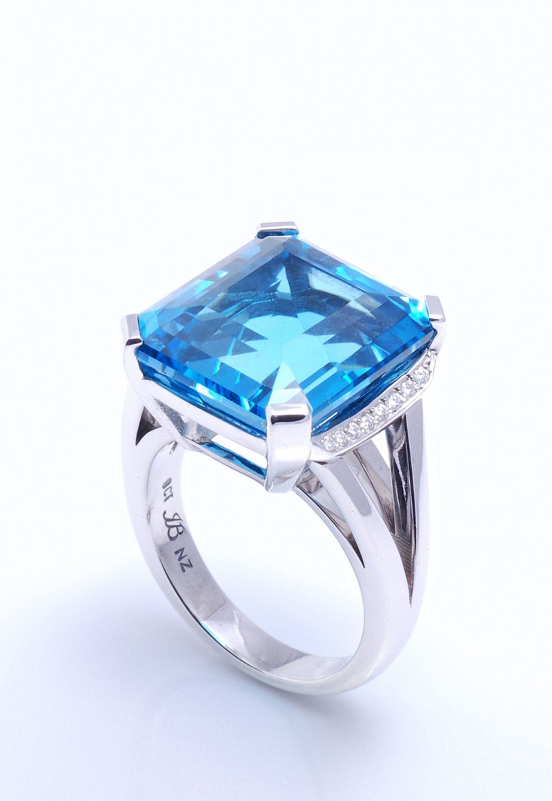 Auckland jewellery designers. Blue topaz, custom design dress ring set in 9 ct white gold with diamonds