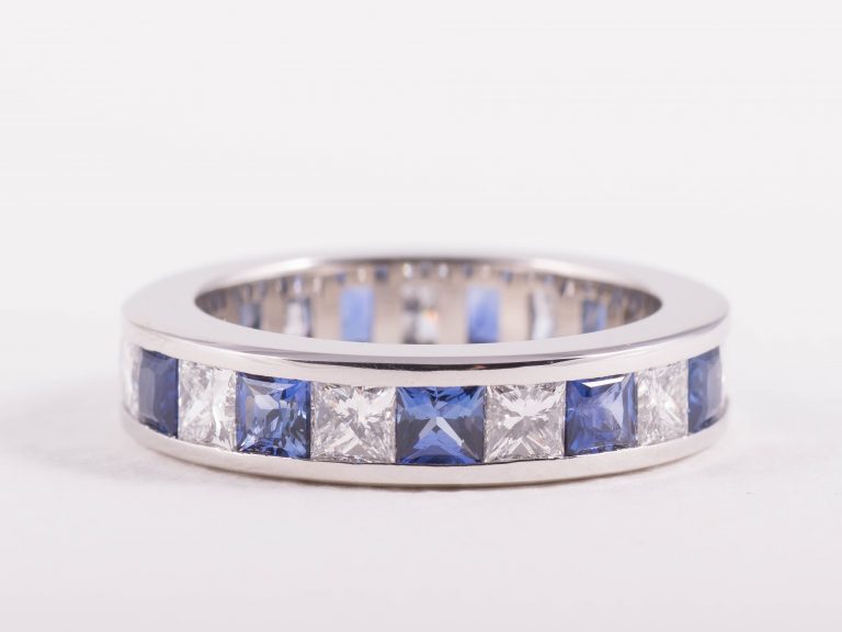 Alternating princess cut Ceylonese sapphire and diamonds ring in platinum by bespoke jewellery designer Julian Bartrom Jewellery.