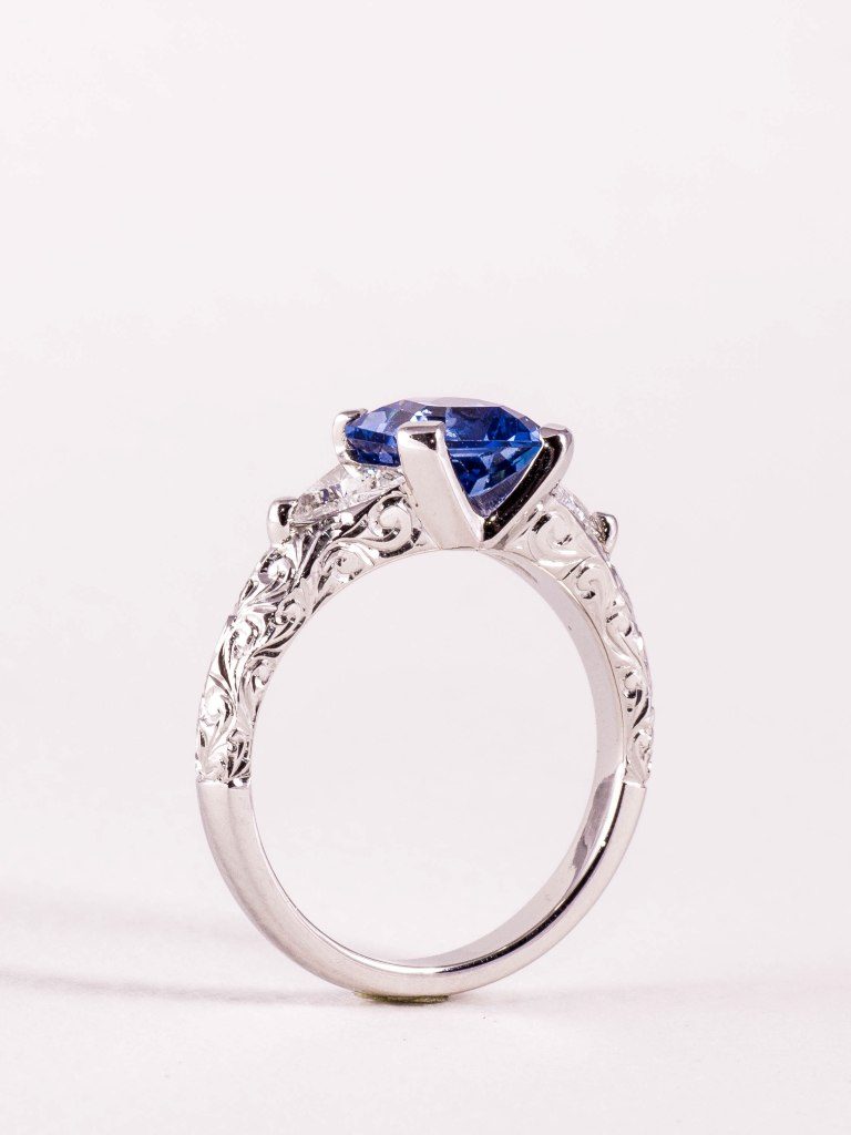 Ceylonese sapphire and diamond engagement ring with hand engraving by bespoke jewellery designer Julian Bartrom Jewellery