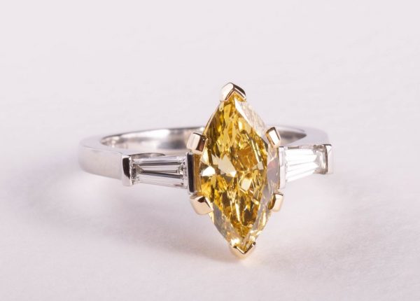 2ct Yellow marquise diamond and tapered baguette diamond ring, crafted in platinum