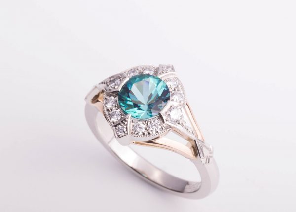 Blue green tourmaline and diamond Art Deco ring crafted in platinum and 18ct rose gold